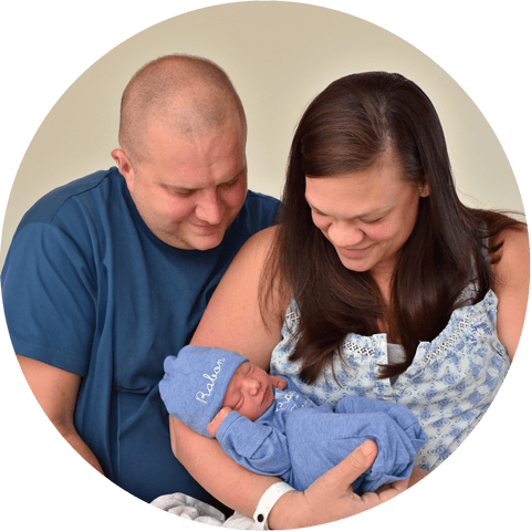 Collin Black with his wife and newborn baby.